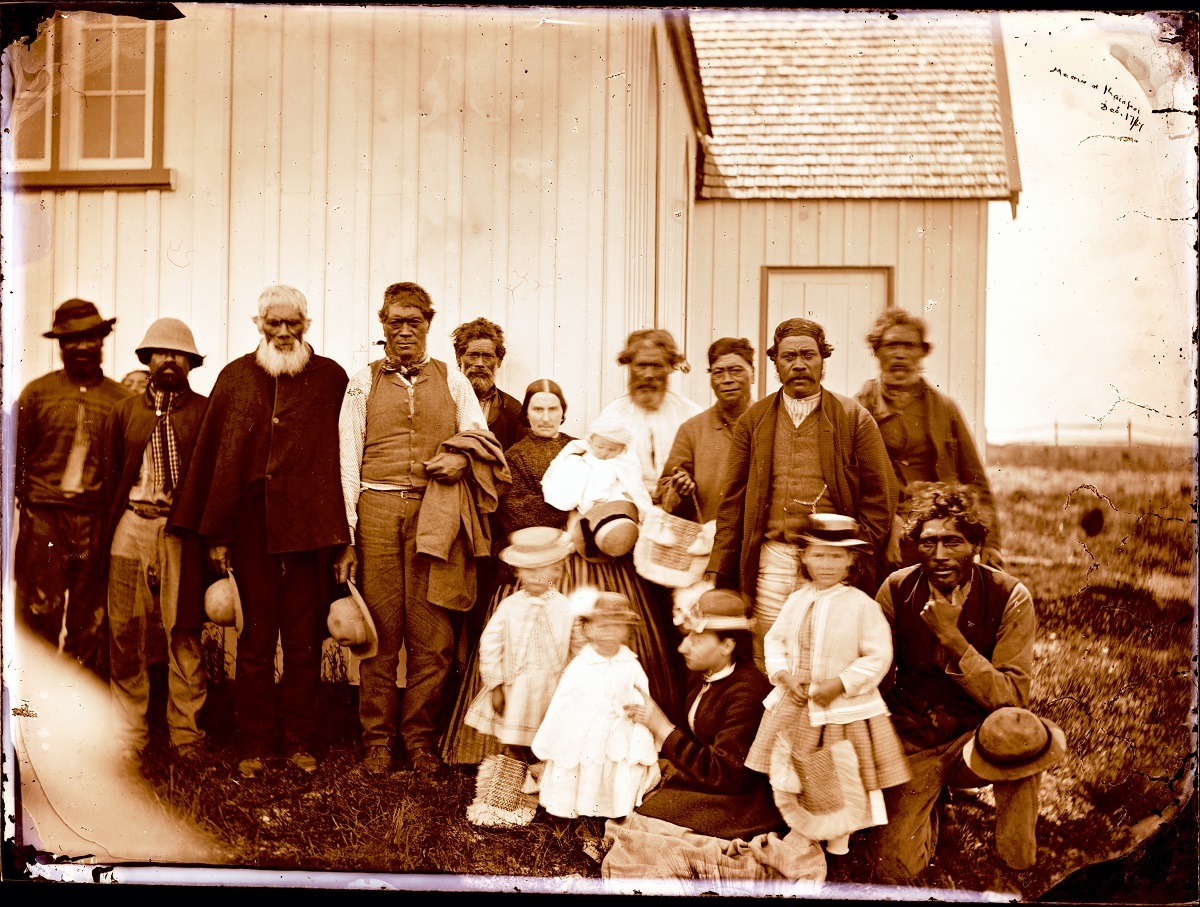 Eliza Stack with her children and Māori friends outside St Stephens Church, Tuahiwi, 17 December 1867. Mary, Eliza’s eldest daughter, (on right) features later in the story. Church worker Pita Te Hori is the man standing second from the right. Photograph by Alfred Barker. Canterbury Museum 1944.78.241