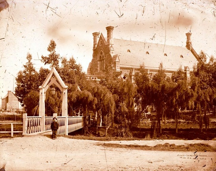 Provincial Council building, stone chamber and Gloucester Street footbridge over the Avon River, Oxford Terrace. Photographed by Alfred Charles Barker on 3 October 1865. Canterbury Museum 1944.78.4372