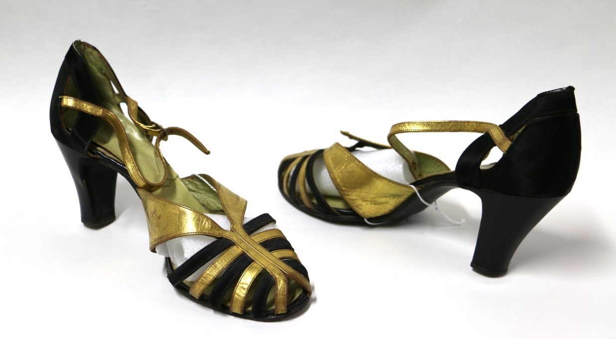 Gold and Black High Heel Sandal Mollie’s collection was not limited to everyday items. A pair of 1937 gold and black women's high heel sandals made by Hollywood represent the glamorous side of fashion. Canterbury Museum 1984.70.2121