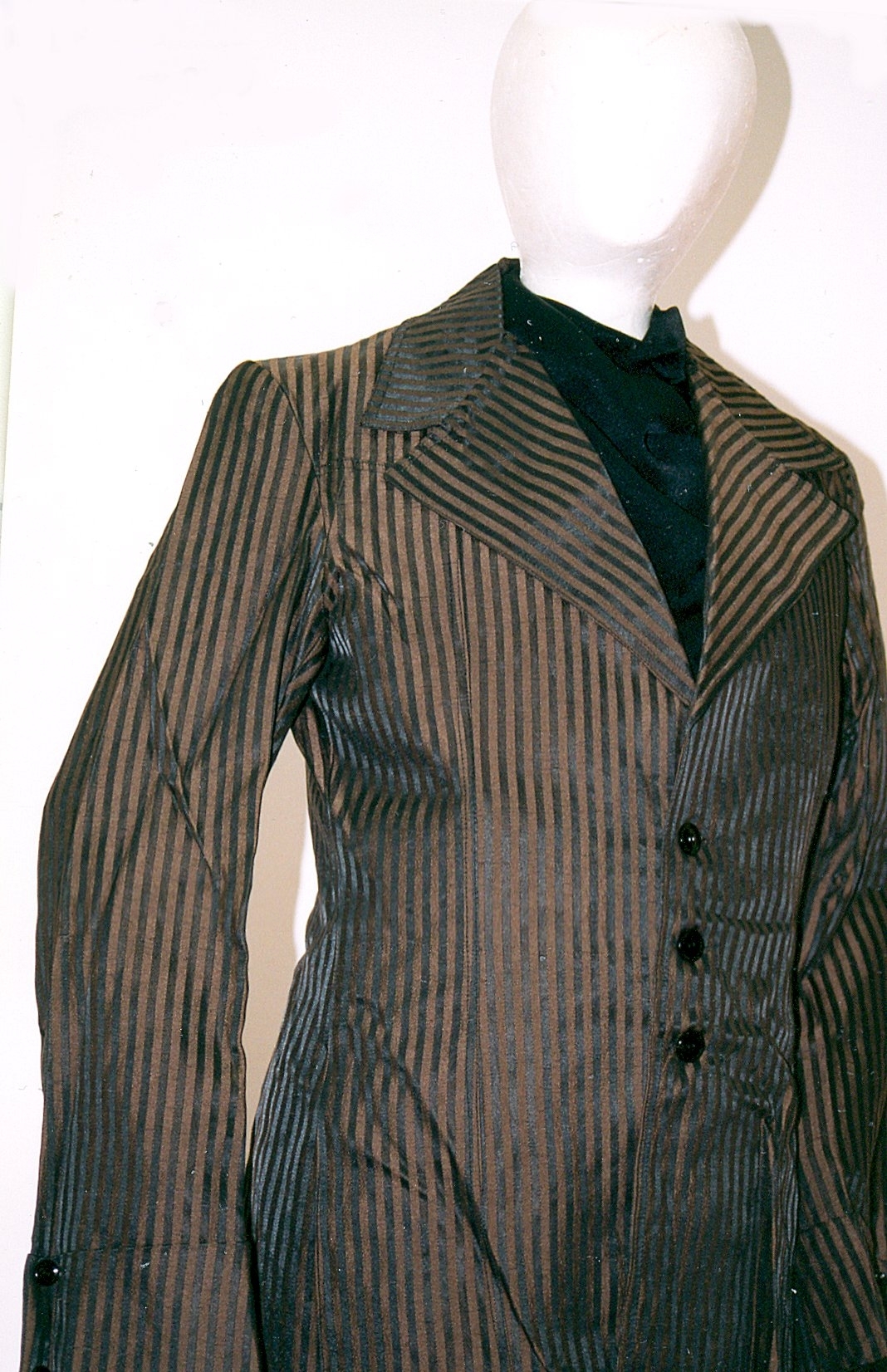 Black and tan stripe men’s single-breasted jacket A black and tan stripe men’s single-breasted jacket epitomises the Teddy Boy look of British subculture in the 1950s where young men copied Edwardian-era fashion. Canterbury Museum 1984.70.15