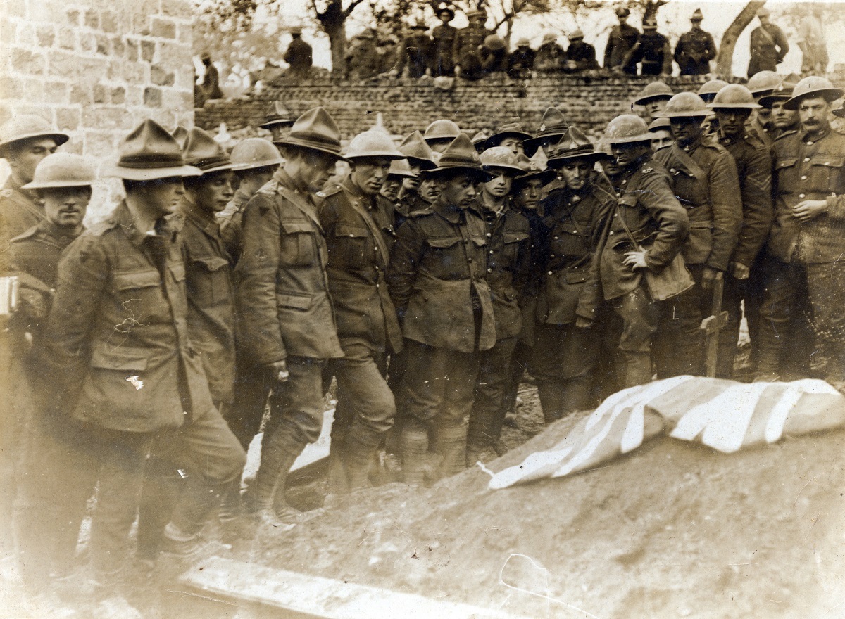 The second burial of Henry Nicholas's body at Vertignuel on 29 October 1918, which was attended by the surviving members of 1st Canterbury Regiment. Canterbury Museum 2002.106.2. No known copyright restrictions