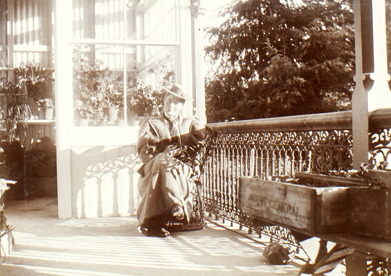 Margaret Stoddart sitting on the verandah of Godley House. Canterbury Museum 2015.114.34. No known copyright restrictions