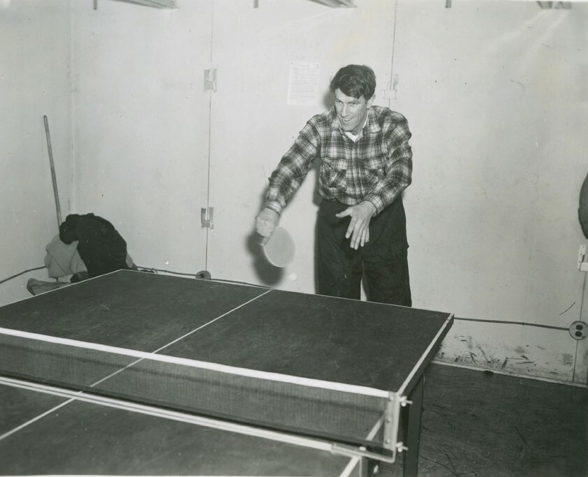 Sir Edmund Hillary playing table tennis during some downtime at Scott Base. Canterbury Museum 2015.113.1167