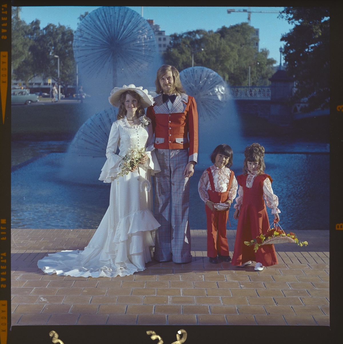 Do you know these fashionable people? This wedding photo was taken in front of the Ferrier Fountain at the Christchurch Town Hall, probably in the 1970s. The negative is labelled Mallory De Gouw. Canterbury Museum 2019.10.852 CC BY NC Available for Media Use.