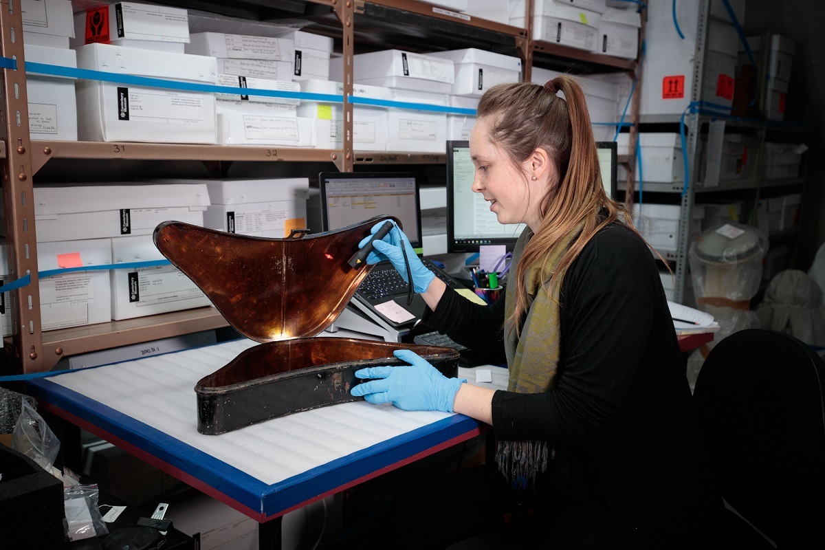 Inventory Team member Olivia Wilson in one of the Museum's storerooms.