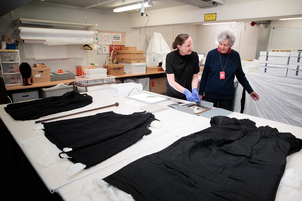 Lisa McDonald, Associate Curator Human History, shows Phillida Watherston a photo of her ancestor Bishop Churchill Julius.