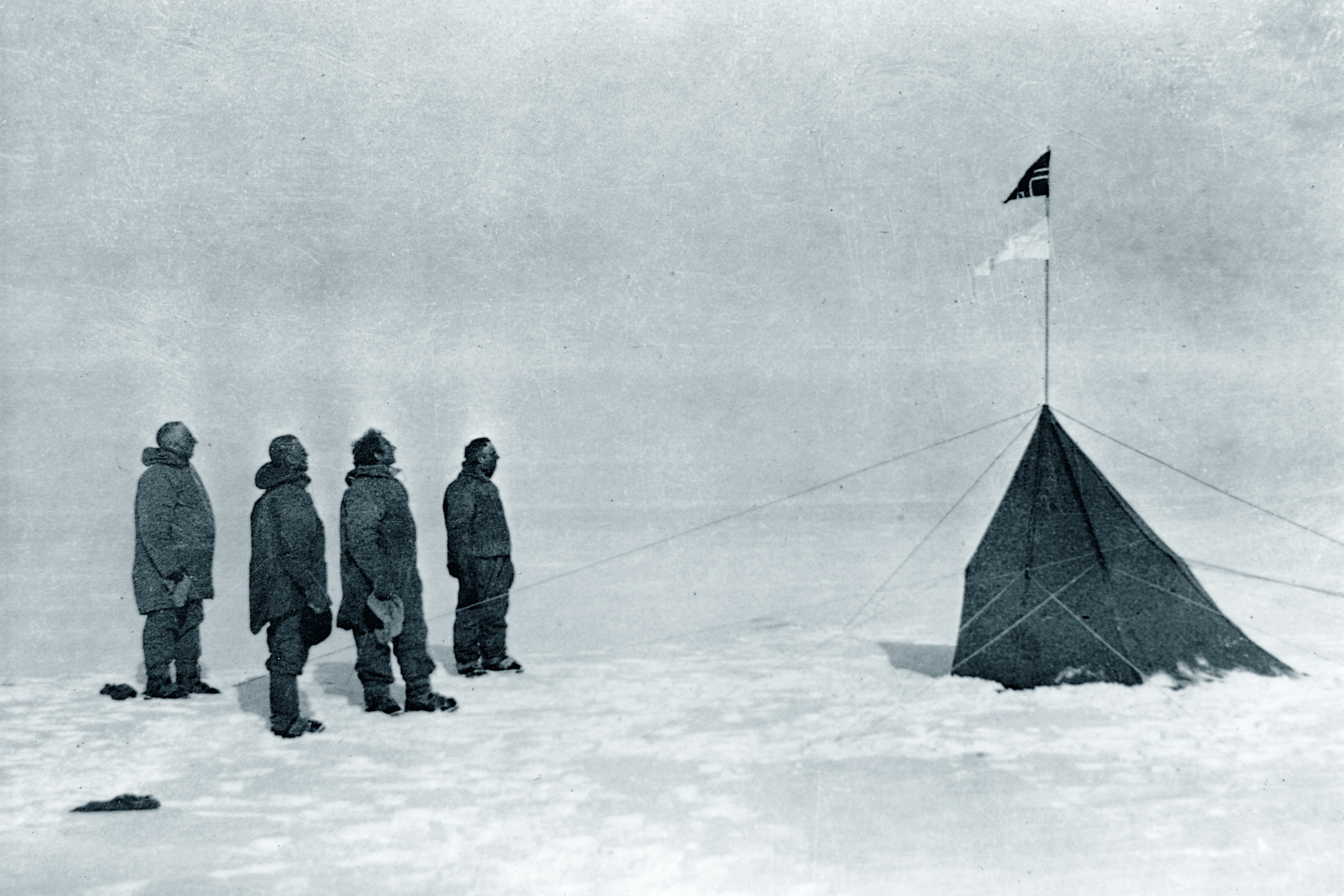 Members of Roald Amundsen's South Pole expedition at the pole in December 1911. From left: Roald Amundsen, Helmer Hanssen, Sverre Hassel and Oscar Wisting. No known copyright