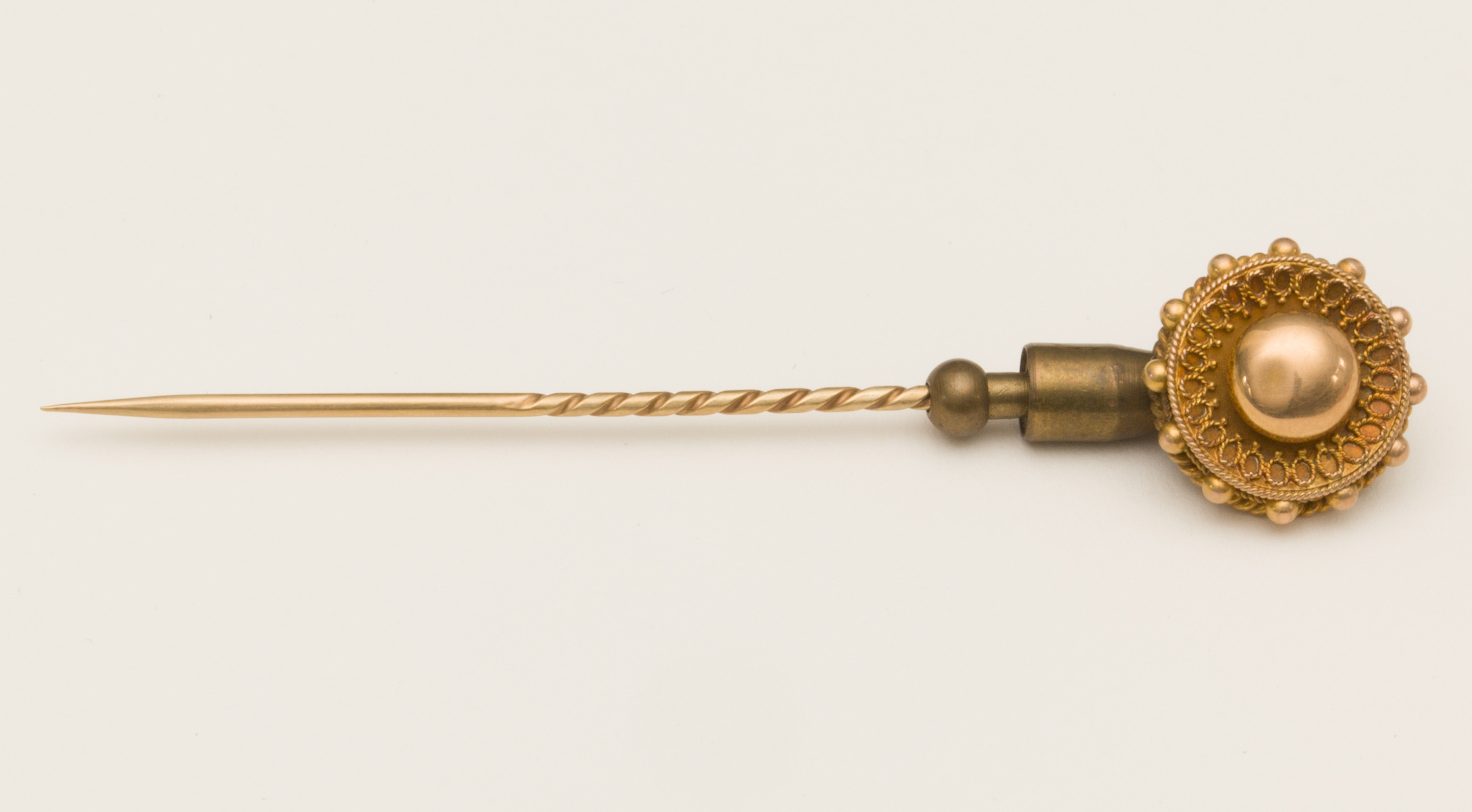 Tie pin adorned with a small ball of gold, some of the first to be found on the West Coast. Canterbury Museum EC187.118
