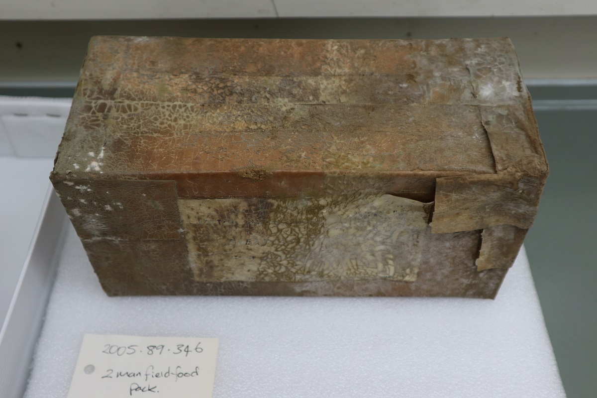 After the mould was cleared off we could see this box read "2 man geologist rations". Canterbury Museum 2005.89.347