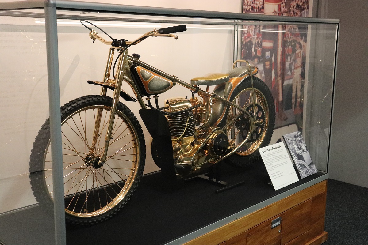 The gold bike is on display in the exhibition Speedway King