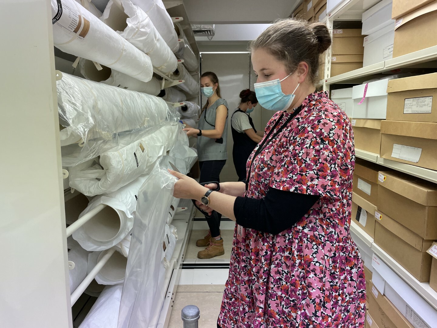 Staff prepare objects in the Museum's textile collection for the move.