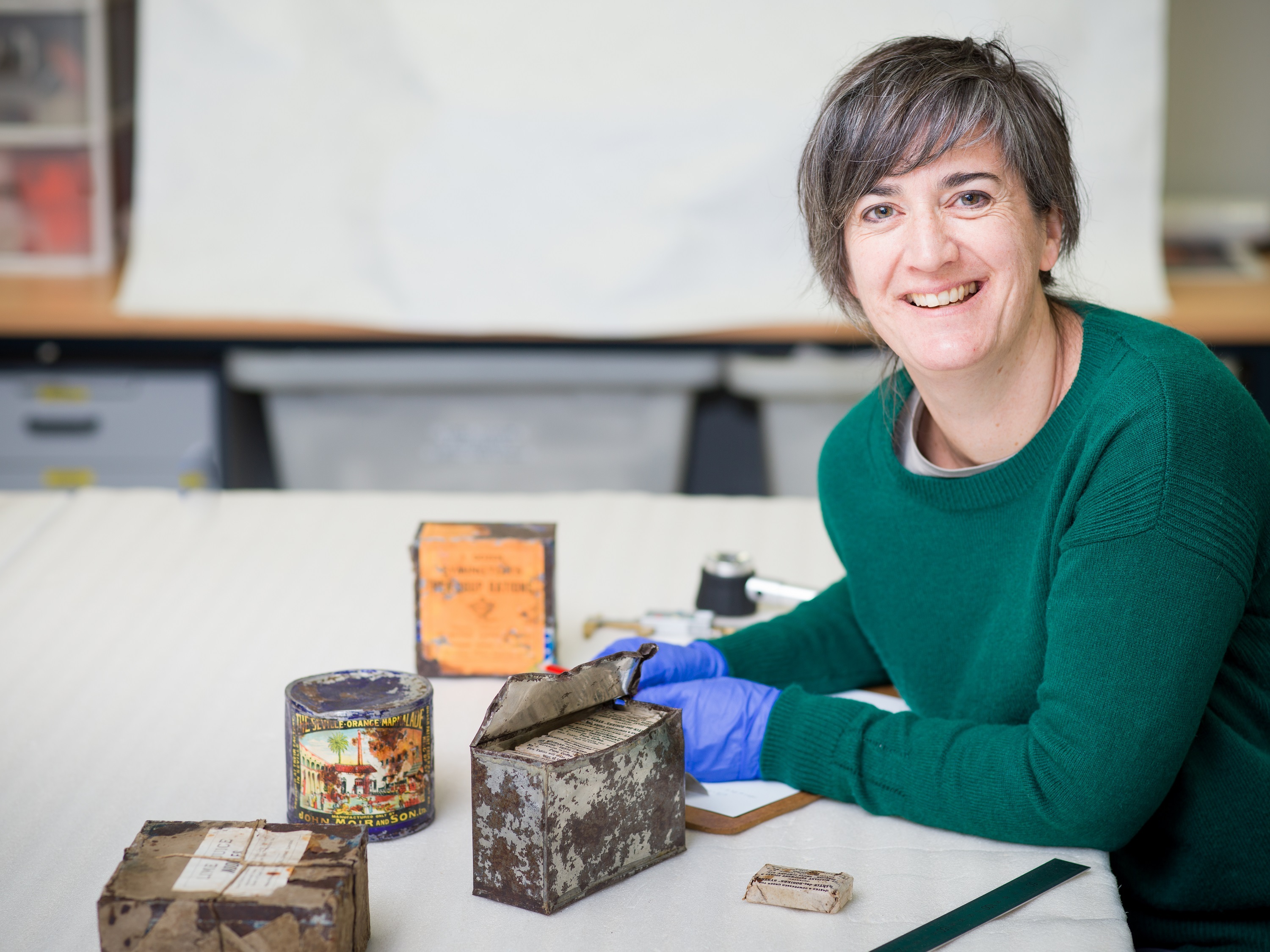 Lizzie Meek Antarctic Heritage Trust Programme Manager – Artefacts condition reports century-old food, including coffee, pea soup and chocolate-covered lime nodules, found in huts at Cape Adare, Antarctica