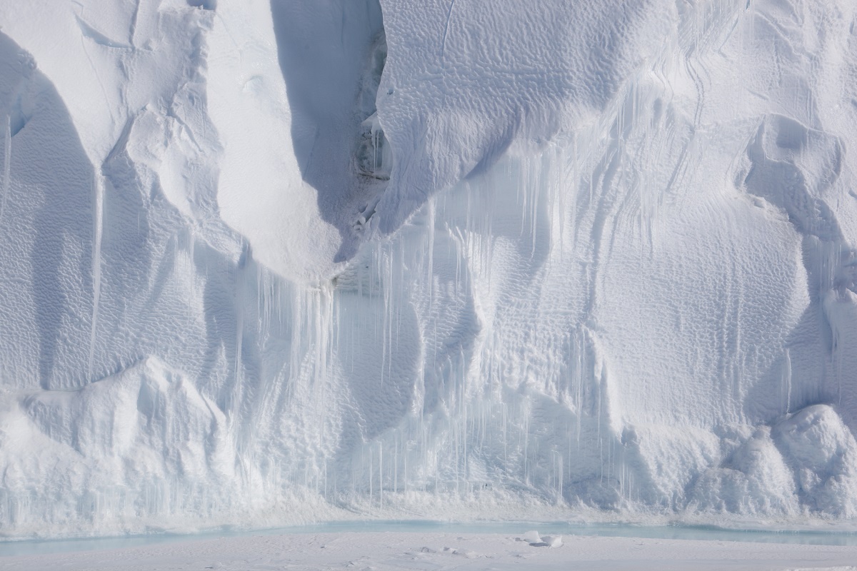 Face of iceberg trapped in frozen McMurdo Sound. Image: Guy Frederick, all rights reserved