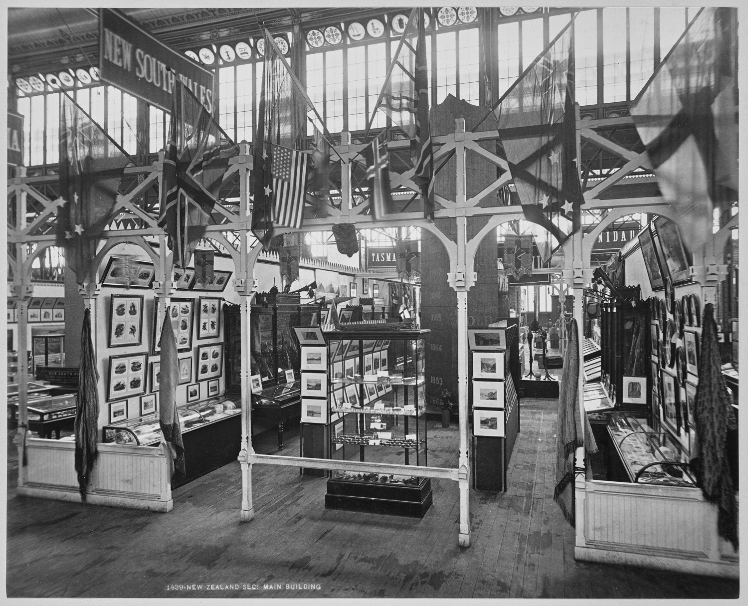 The New Zealand Court at the 1876 International Exhibition, Philadelphia, USA. Cooper’s paintings are on the two shelf ends facing the viewer (four on each side). Alexander Turnbull Library PA1-f-257-12