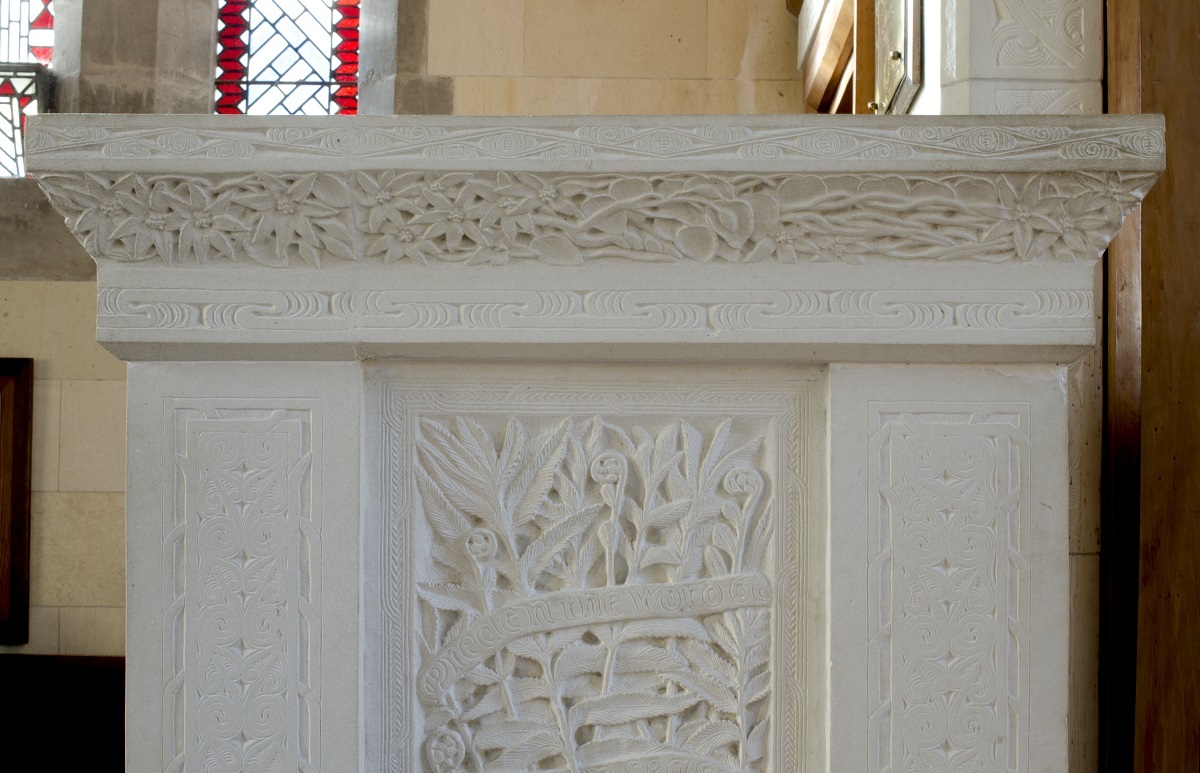 This detail of the pulpit shows a typical Menzies’ combination of Māori patterns and botanical reliefs of indigenous clematis and ferns, and text: Preach the word. Photograph by the author, 2016. All Rights Reserved